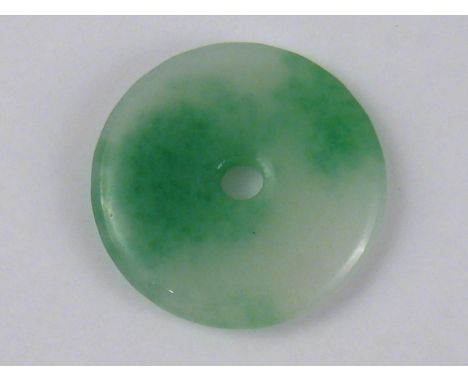 A Chinese jade disc pendant, approx 4cm diameter.