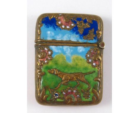 A white metal stamp box in the shape of a vesta enamelled with a gun dog. 2.5x3.5cm. 