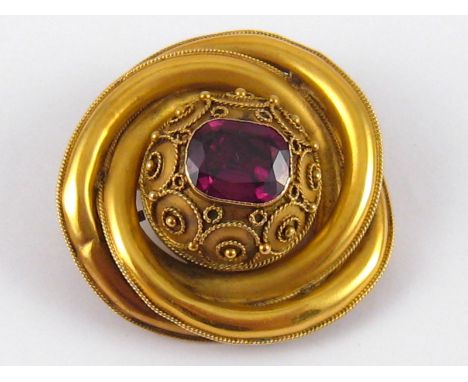 An antique yellow metal (tests 15 carat gold) brooch, stone approx. 10 x 7.5mm, brooch approx. 4cm wide, 8.5 gms, in associat