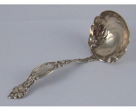 An American silver, marked sterling, Art Nouveau ladle. Wt. 92gm. 