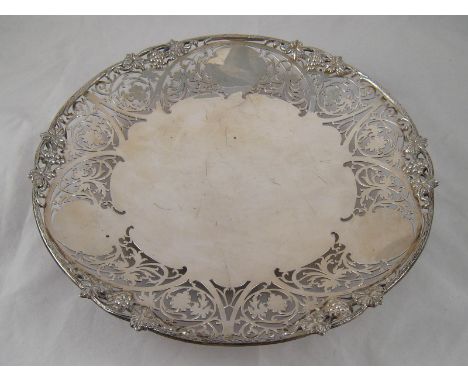 A silver pierced open dish with applied vine and grapes edge and raised foot rim, Sheffield, 1967, retailed by Garrard & Co. 
