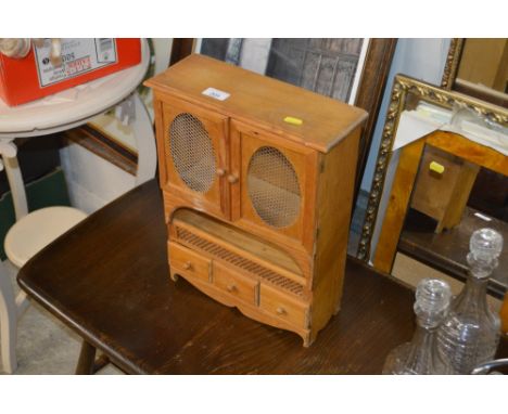 A pine spice rack, fitted three drawers
