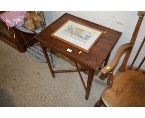 A mahogany side table raised on x frame supports