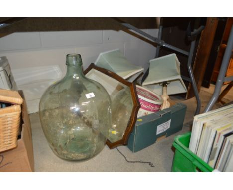 A green glass car boy; an oak framed mirror and a box containing table lamp bases etc.