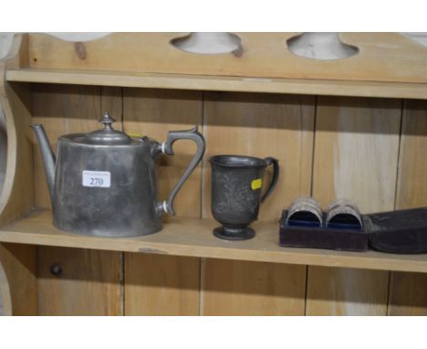 A pewter teapot; mug and a set of six silver plated serviette rings in fitted leather box