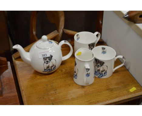 A Beverley Hewitt teapot with matching cream jug and two mugs