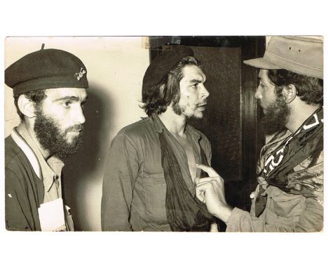1959 Che Guevara, Cuban press photograph. A black and white photographic print of El Commandente Ernesto Guevara" with two ot