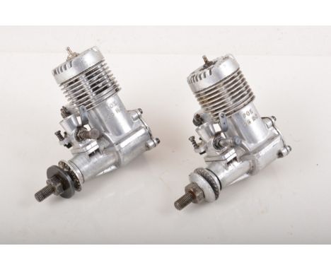 Two FOX R/C glow engines 25 CID, one without silencer.