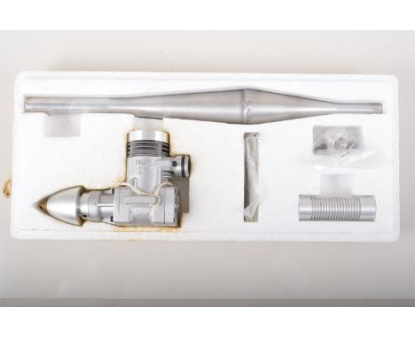H G K 15 racing engine, with tuned pipe, new in box.