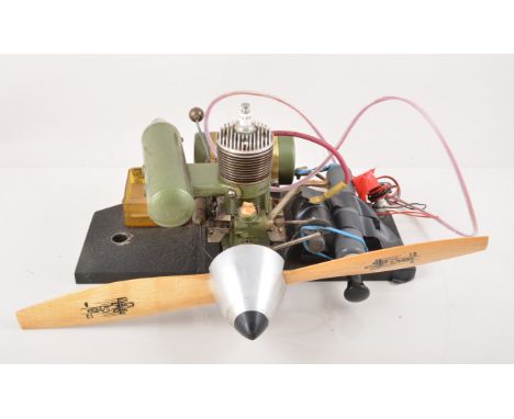Dunham replica of an Orwick 64 Sparky, mounted on metal stand, complete with ignition coil, electrics, tank, silencer, prop a