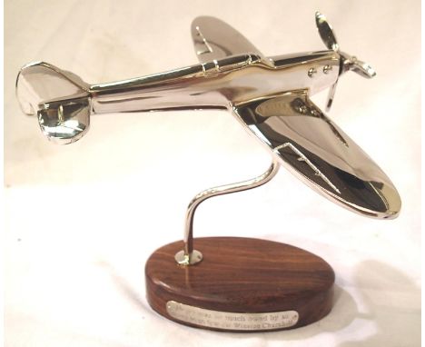 Chrome Spitfire on wooden base, 22 cm wingspan. P&amp;P Group 1 (£14+VAT for the first lot and £1+VAT for subsequent lots) 