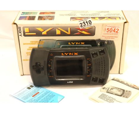 Atari Lynx handheld console, boxed. P&amp;P Group 3 (£25+VAT for the first lot and £5+VAT for subsequent lots) 