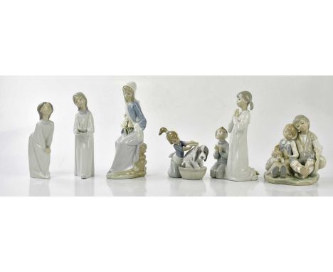 LLADRO; six figures including puppy bath time.Condition Report: All appear in good condition.