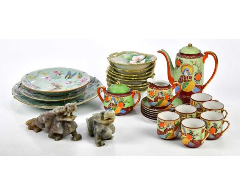 A Japanese Samuri china Satsuma tea/coffee service, together with a pair of soapstone figures.