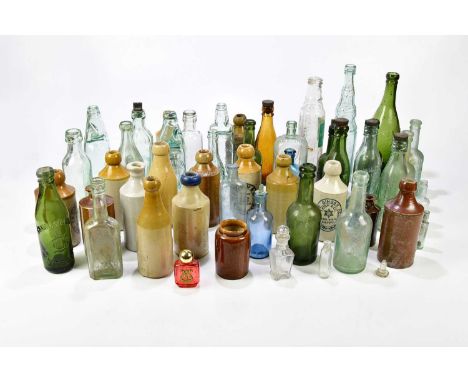 A large collection of assorted Codd bottles, ginger beer and flagons to include CW Parker of Warrington, Rose's Lime Juice bo
