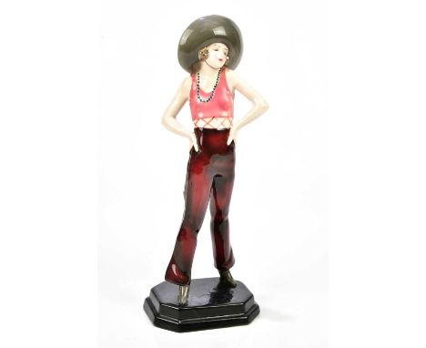 GOLDSCHEIDER; an Art Deco figure of a girl wearing a sombrero with a beaded necklace on a square plinth base, height 43cm.Con