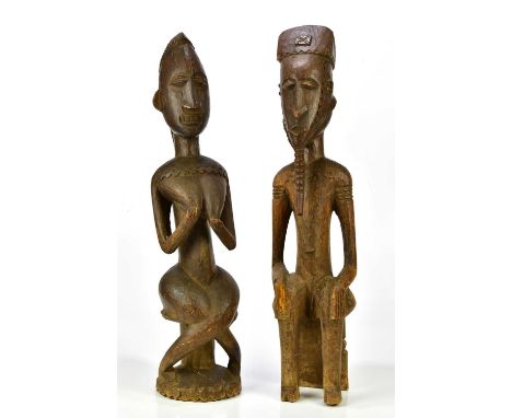 Two hardwood carved African figures of male and female, height of largest 71cm.