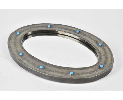 DAUM; a sheet pewter oval wall mirror with relief decoration and eight applied cabochons, 33cm x 23cm.Condition Report: Very 