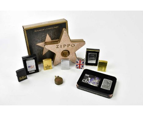 ZIPPO; a small collection of lighters including Jim Beam, The Beatles, Hollywood's Leading Light, Our Century, USA and the Li