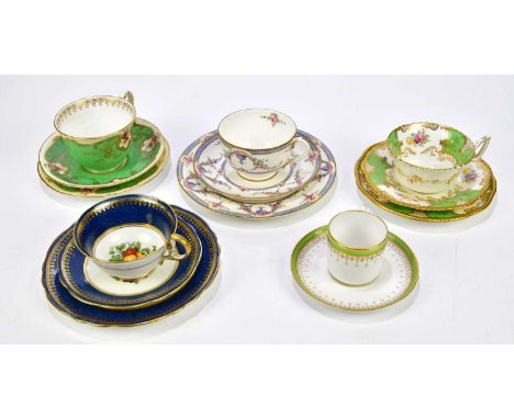 ROYAL WORCESTER; a hand painted and gilt decorated trio, an Aynsley trio decorated with fruit, a Coalport Batwing trio, a Roy