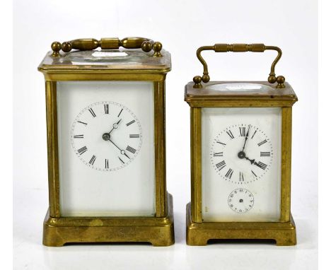 Two brass cased carriage clocks, both with white enamel dial, one set with subsidiary dial, both with Roman numerals, largest