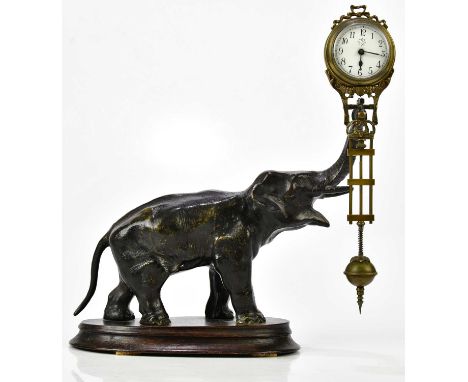 An early 20th century bronze spelter mystery clock modelled as an elephant supporting the rotating timepiece with Junghans mo