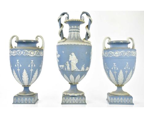 WEDGWOOD; a trio of 19th century twin handled pedestal vases, the larger vase with trailing serpents to the handles, decorate