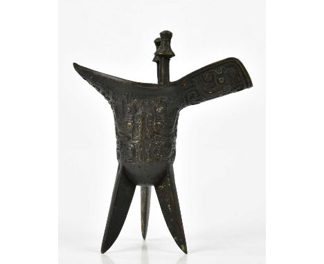 A Chinese bronze jue of archaic form, height 22cm.