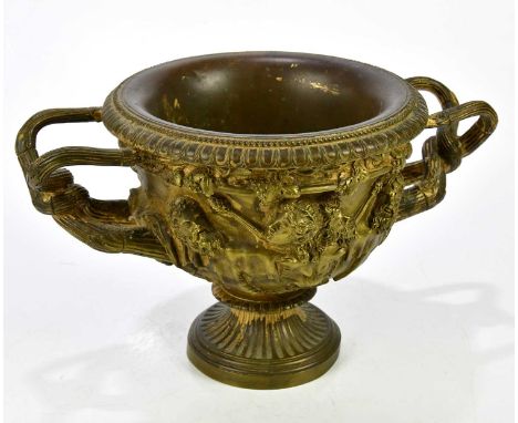 A late 19th century cast bronze Warwick vase, height 21cm, width 34cm.Condition Report: There are cracks to both handles, tar