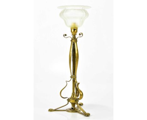 ATTRIBUTED TO W.A.S BENSON; an Arts and Crafts brass table lamp with vaseline coloured shade, height 46cm.