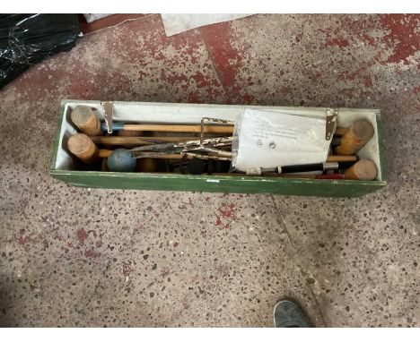 A pine cased vintage croquet set.