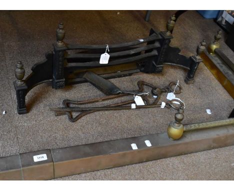 A brass fire fender, 185 x 55cm, together with fire tools and a cast iron fire front.
