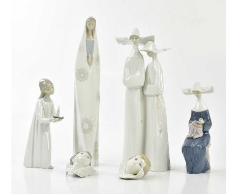 LLADRO; four figures including two nuns walking, height 32cm with two wall plaques modelled as angels (6)Condition Report: Ea
