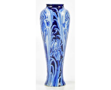 WILLIAM MOORCROFT; a large Florian ware vase decorated with irises on a blue on blue ground, green signature and printed mark