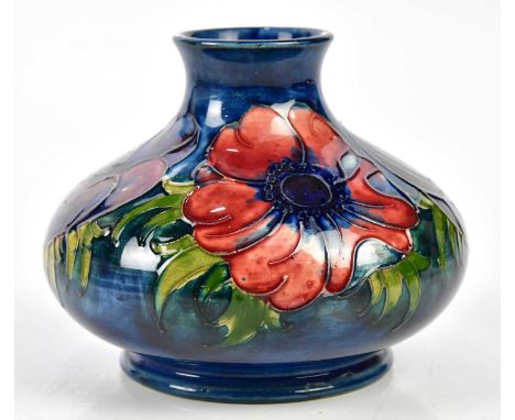 MOORCROFT; a squat vase decorated in the 'Anemone' pattern on a blue ground, impressed marks, height 9cm.Condition Report: Li