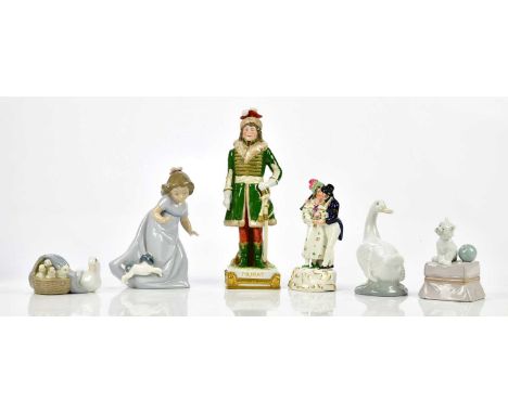 NAO; a model of a girl beside a puppy, with a Lladro model of a puppy sat beside a ball, a Lladro figure of ducklings, Staffo