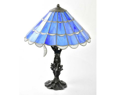 An Art Nouveau style silvered metal table lamp representing a maiden supporting the leaded glazed shade, height 49cm.