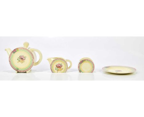 CLARICE CLIFF; a four piece part tea service in the Bonjour shape, decorated with central flower within linear border in past