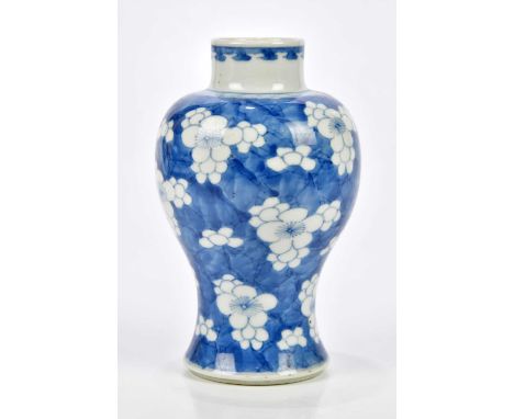 A late 19th century Chinese blue and white porcelain temple jar decorated with prunus flowers, bears Kangxi double ring mark 