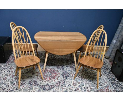 ERCOL; a light elm drop leaf table, 125cm, with a set of four arched spindle back chairs (5)