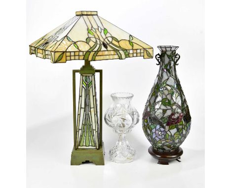 An Art Deco style table lamp and shade in the manner of Tiffany, with stylised motifs, height 68cm, with a leaded table lamp 