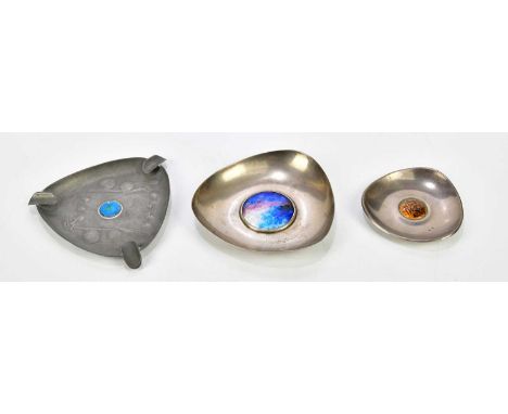 ARCHIBALD KNOX FOR ENGLISH PEWTER; a triangular shaped ashtray, set with enamel cabochon to the centre, width 14cm, together 