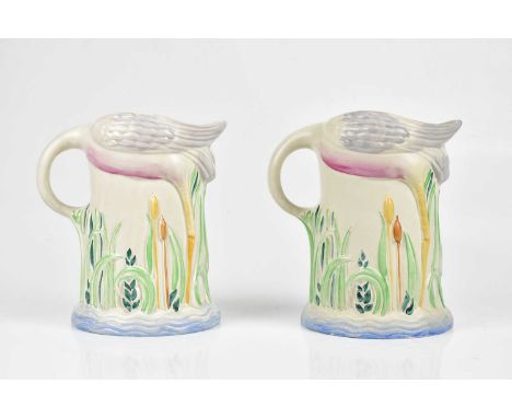CLARICE CLIFF; a pair of 'Flamingo' jugs, height 19cm.