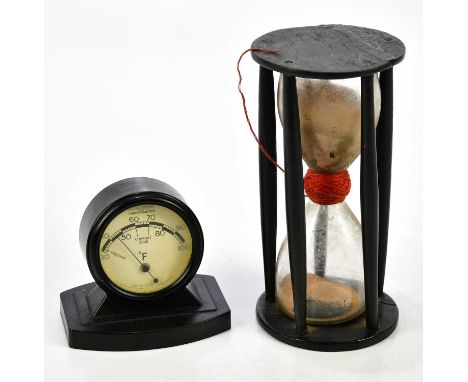 A Rototherm bakelite thermometer together with a 19th century sand timer.