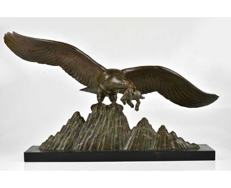 L.GIBERT; a bronze figure of an eagle, signed, on slate base, height 45cm.Condition Report: At some point the eagle has been 