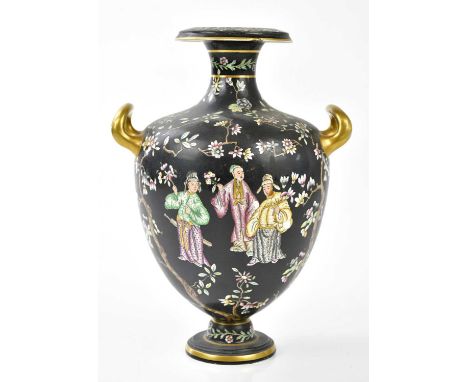 COPELAND; a 19th century twin handled pedestal vase decorated in the Oriental style with figures and floral sprays on a black