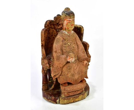 A Chinese carved wood sculpture, possibly of Guan Yin, with traces of gilt to the wood, height 30cm.