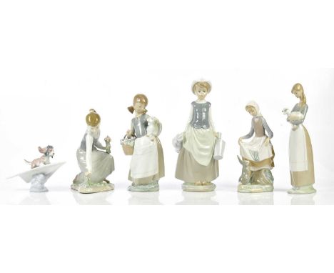 LLADRO; six figures to include a puppy and a boy with plane.Condition Report: Girl holding lamb is missing her fingers on her