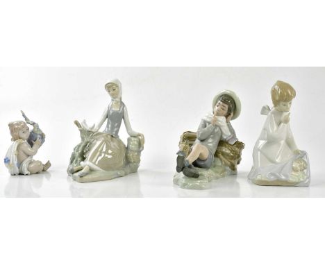 LLADRO; a group of figures including an angel and a sleeping child (4).