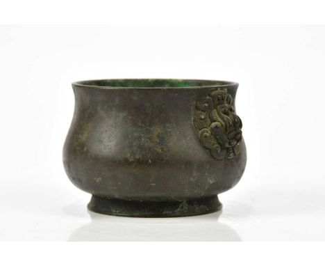 An 18th century Chinese bronze censer, with Taotie handles with flared rim, impressed six character seal mark, height 7.5cm, 